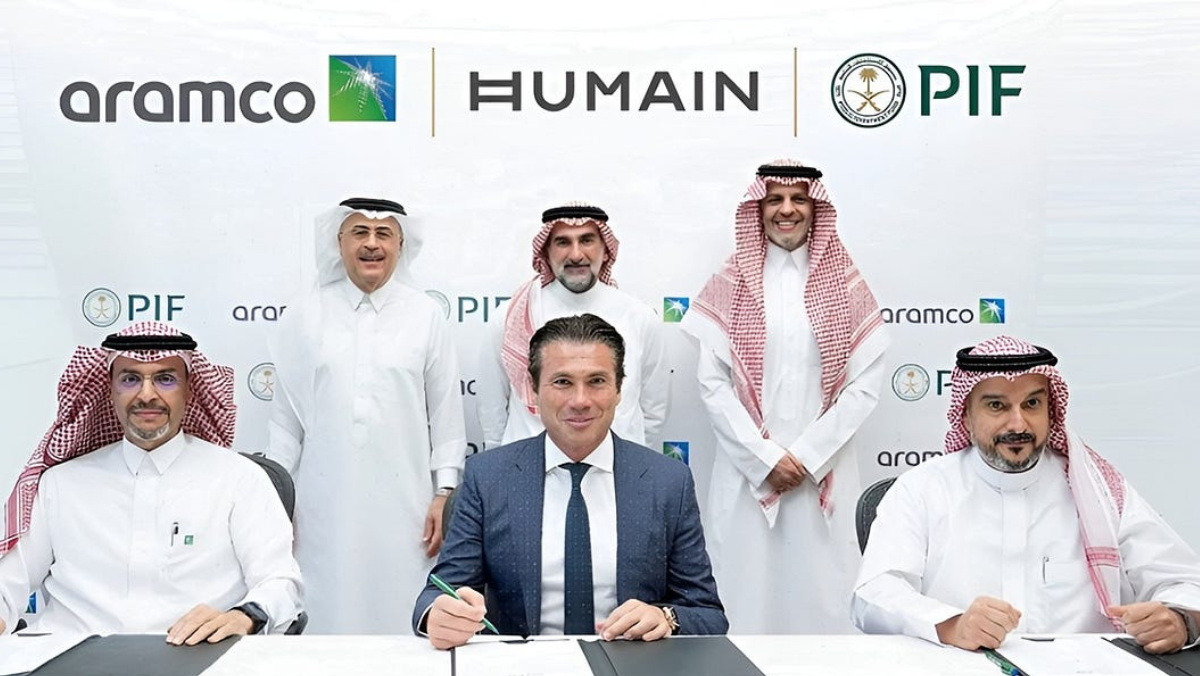 Saudi Aramco and Humain executives pictured during an AI investment signing ceremony