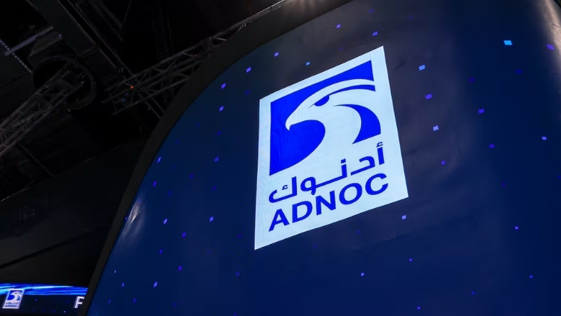 ADNOC logo on illuminated display backdrop
