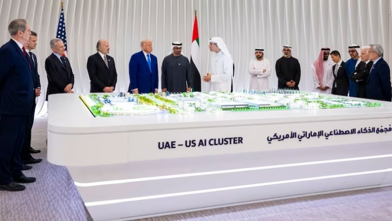 US and UAE officials stand around AI Cluster presentation table
