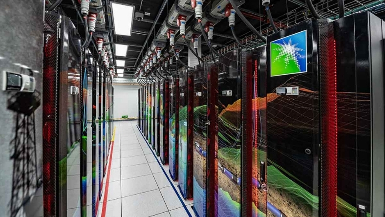 GPU server racks in data centre with seismic display on screen