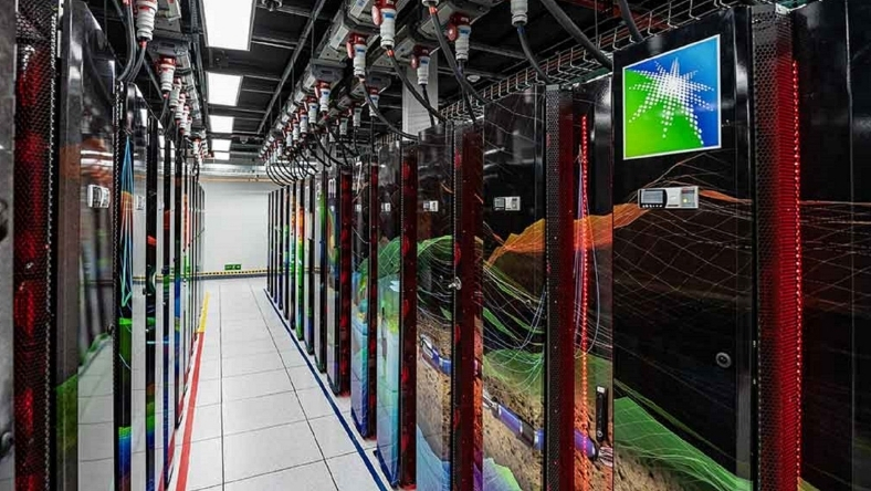 Aramco data centre with illuminated server racks, red LED strips and branded display